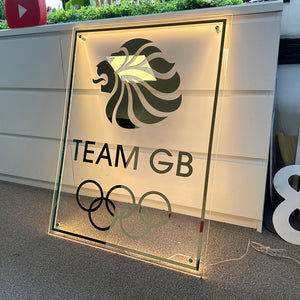 Illuminated Team GB acrylic sign with lion logo and Olympic rings.